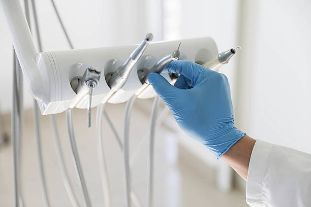 Professional Tooth Extraction technician working in Brazos County County, TX